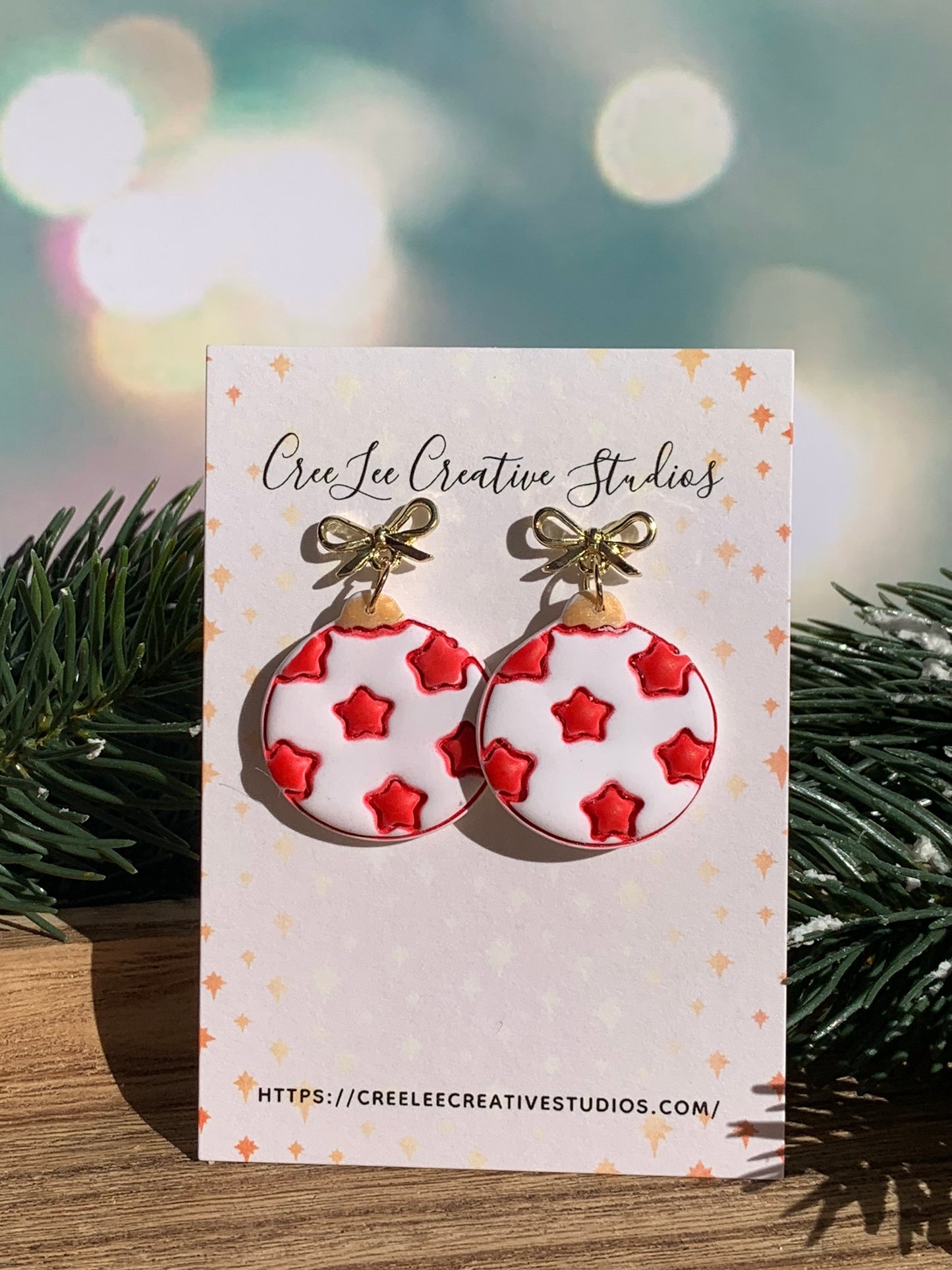"New" Winter - Red Star Dangle Earrings – White Ornament, Gold Bow, Hand-Painted