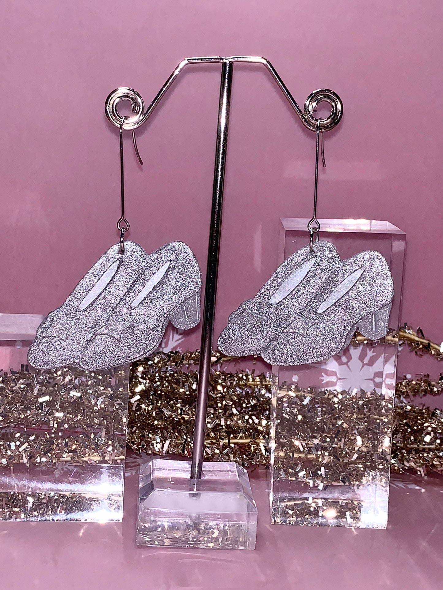 Silver, glittery earrings inspired by Wicked and Cinderella.