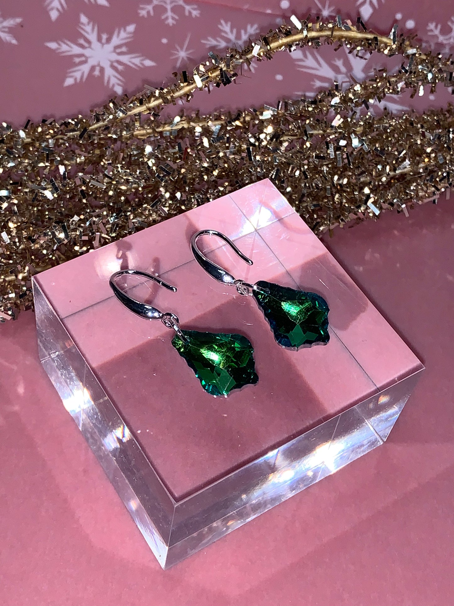 green crystal glass palm shaped earrings on a hook