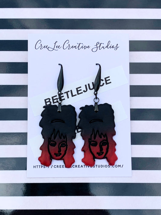 Ombre black to red earrings featuring Lydia Deetz on an earring card branded for CreeLee Creative Studios.